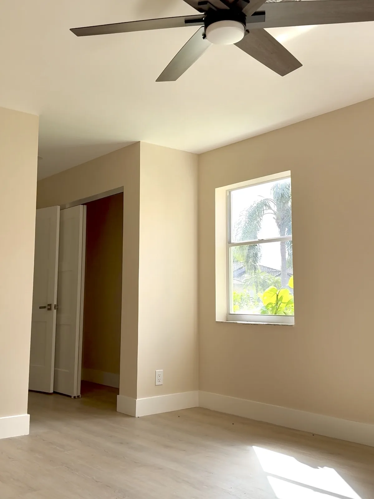 Bedroom after popcorn ceiling removal, smooth ceiling and finished walls