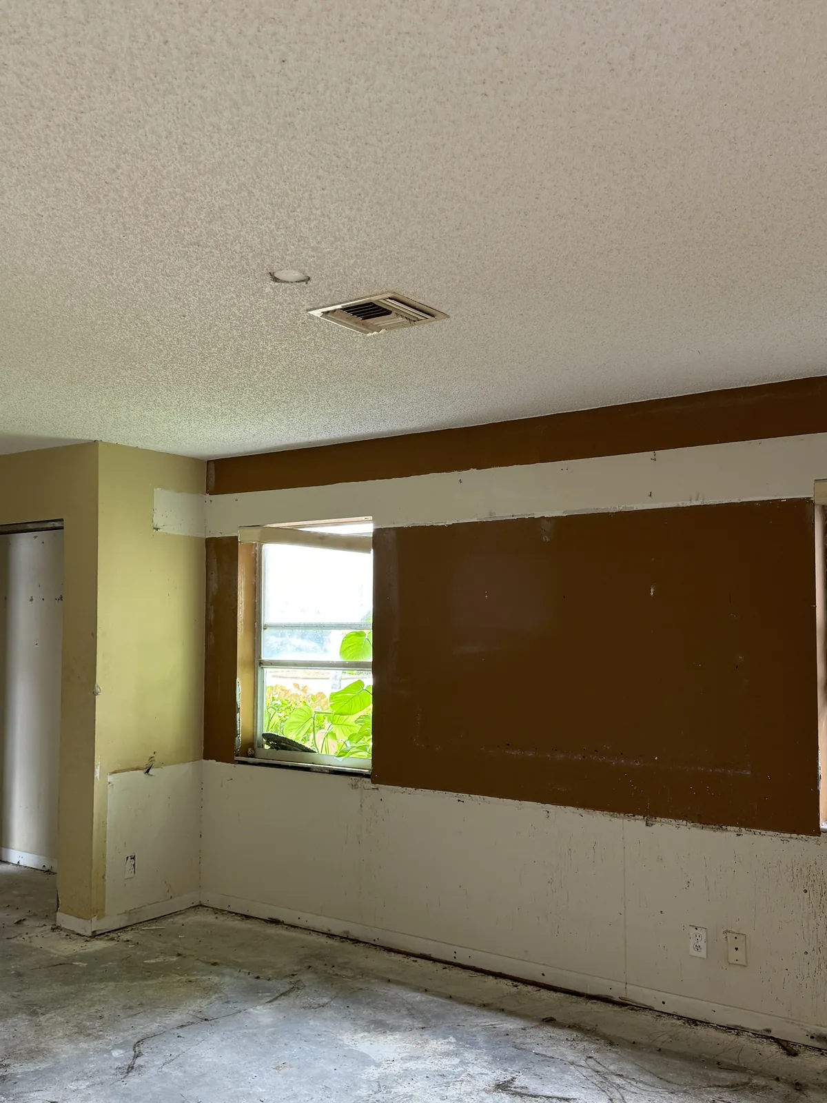 Bedroom with popcorn ceiling before removal